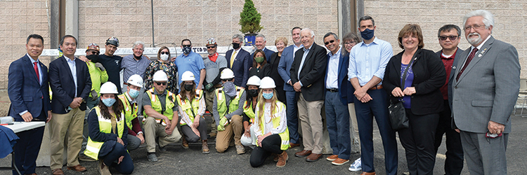 Suffolk, Skanska USA Building, Inc., Perkins Eastman and the city hold topping off at new Lowell High School gym